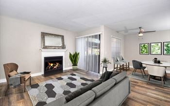 A living room with a fireplace and a couch
